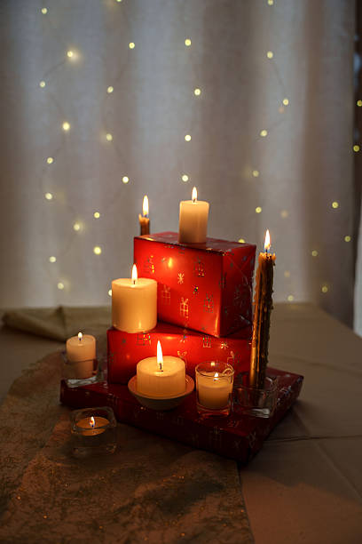 istock andlelit scene with softly glowing lights and red gift boxes on elegant tablecloth exuding christmas warmth 2252937771