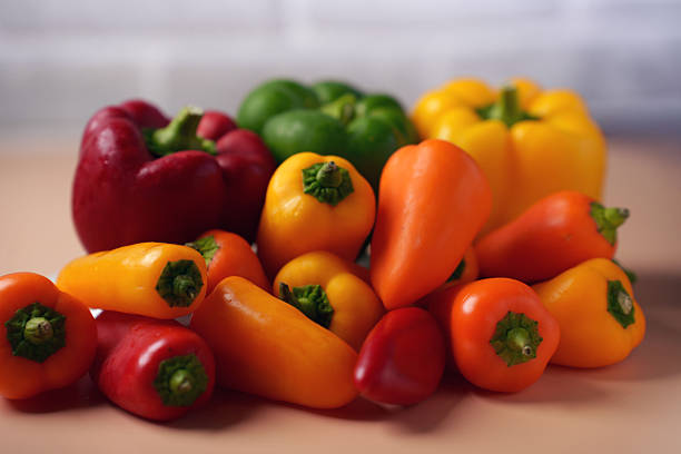 istock vibrant array of colorful bell peppers arranged on a neutral surface with soft focus, showcasing rich reds, oranges, yellows, and greens in a wholesome, fresh display, vegetable, color, ripe, juicy 2252938189