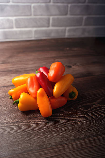 istock vibrant array of red, orange, and yellow peppers 2252938205