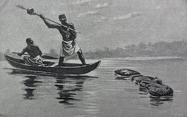 istock Antique illustration - Indigenous African men in a boat aiming a spear at a hippopotamus 2252938971