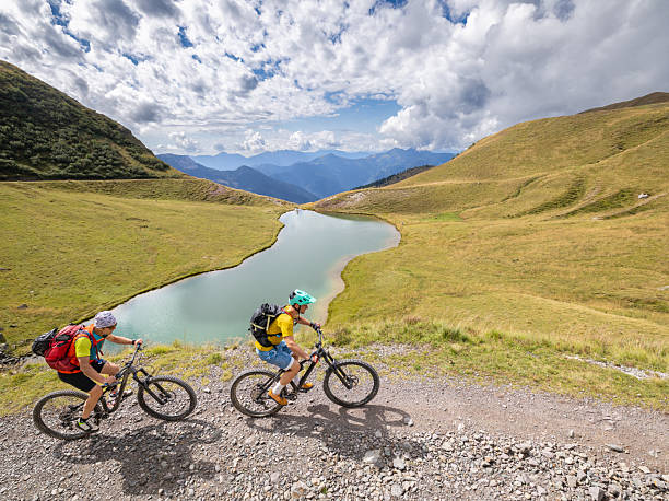 istock Mountain biker at alpine lake. 2252940156