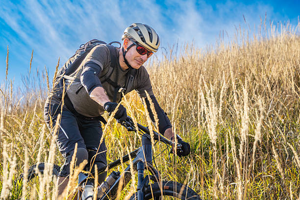 Adrenaline, blur and athlete riding a motorcycle in nature training for a race, marathon or competition. Sports, motion and male biker practicing for an outdoor fitness cardio exercise or workout.