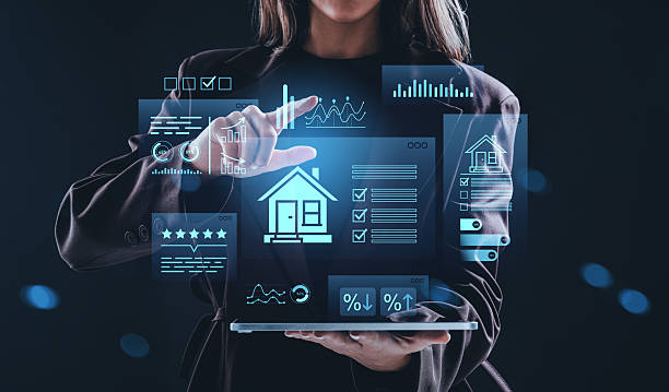 istock Woman using futuristic holographic interface with real estate analytics and housing data on dark background, representing smart property management concept. 2252941620