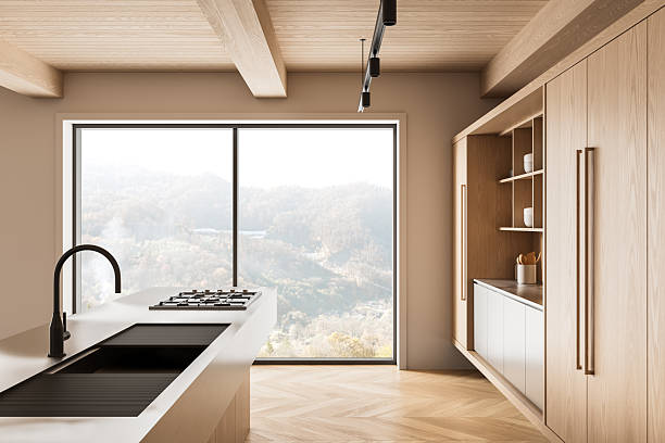 istock Modern minimalistic kitchen interior design with natural wood elements and large window overlooking mountain landscape, stylish and serene atmosphere. 3D Rendering 2252941914