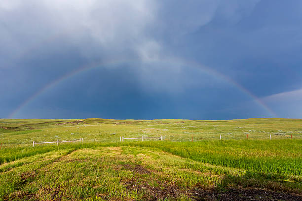 Double rainbow over the prairie in Badlands National Park after a summer storm, South Dakota