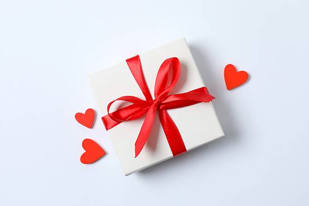 istock Beautiful gift box with red hearts on white background 2252943597