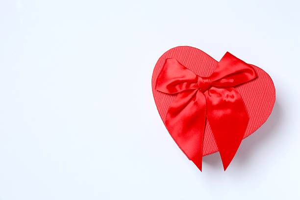 istock Beautiful gift box with red bow on white background 2252943826