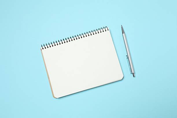 istock Flat lay with pen and notebook on blue background, top view 2252944052