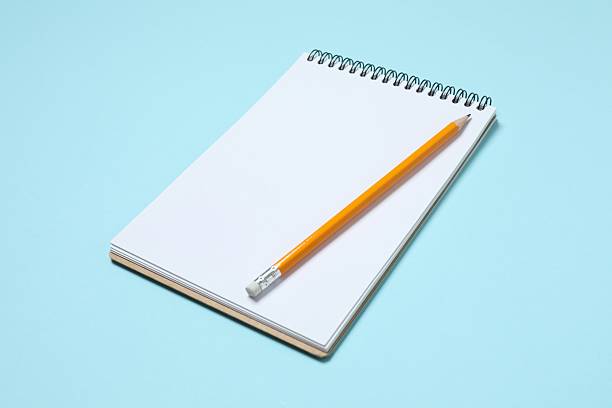 istock Flat lay with pencil and notebook on blue background, top view 2252944072