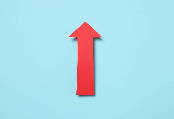 istock Paper arrow on color background, top view 2252944096