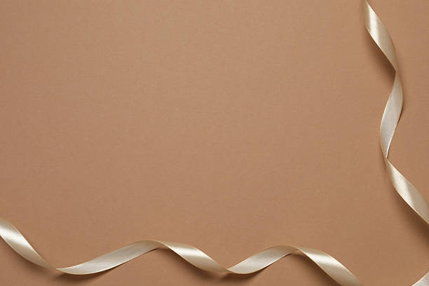 istock Beautiful silk ribbon on color background, space for text 2252945385