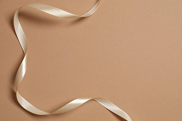 istock Beautiful silk ribbon on color background, space for text 2252945387