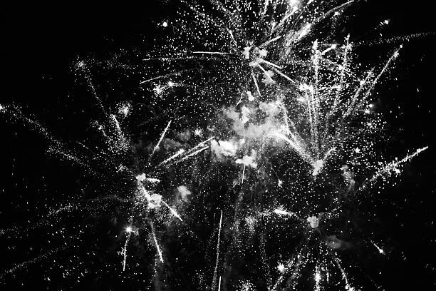 istock Black and White Fireworks Explosions in Night Sky 2252945830