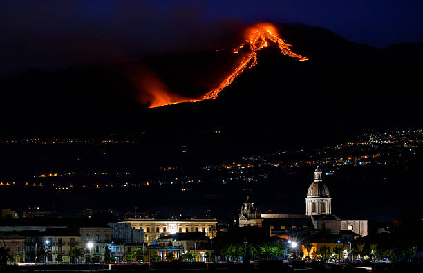 istock A mountain with a volcano on top and a city below 2252949677