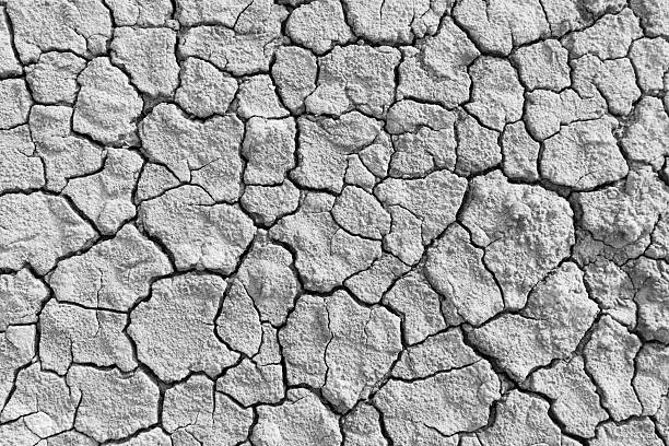 istock The soil surface is cracked, dry, and barren,Cracked soil 2252959722