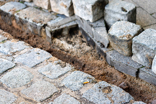 istock Cobblestone pavement under repair exposing sand and dirt 2252964260