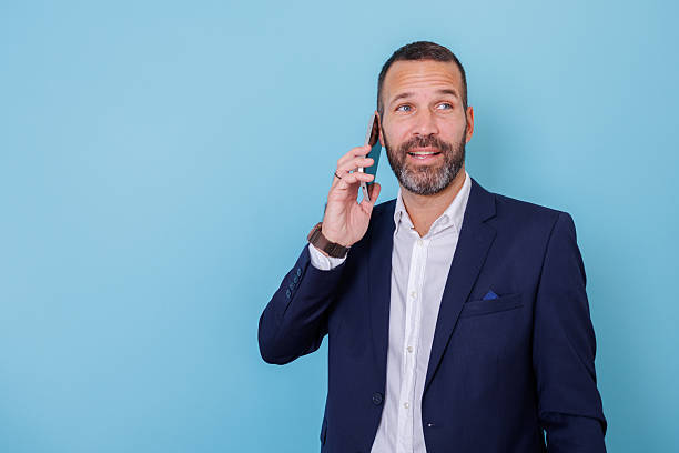 istock Businessman having phone call looking away while communicating and making a business decision 2252967618