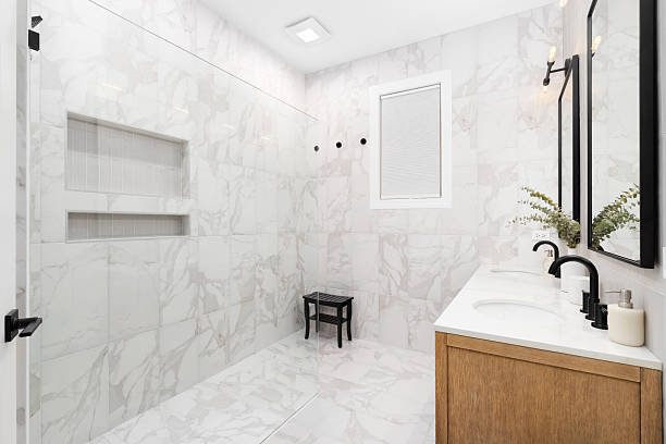 istock A bathroom with a white oak cabinet and marble tiles. 2252975010