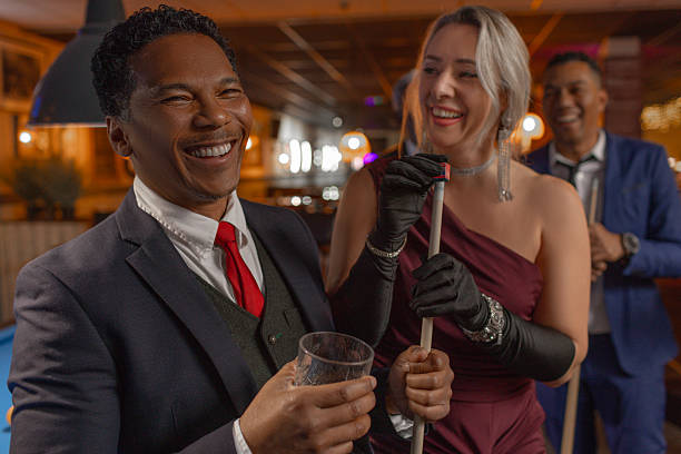 istock Group of elegant senior friends at a pool hall 2252982134