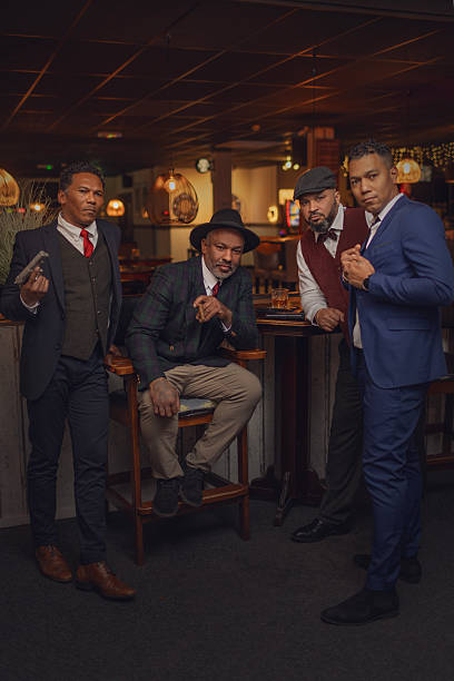 Small group of luxury black men friends enjoying downtime at a drinking bar in the Netherlands