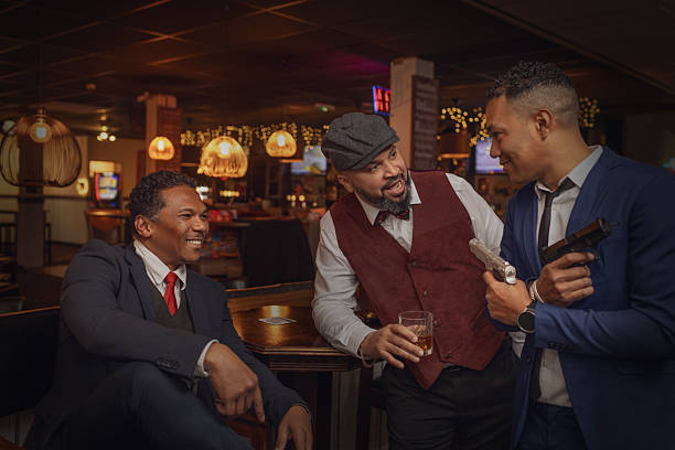 Small group of luxury black men friends enjoying downtime at a drinking bar in the Netherlands