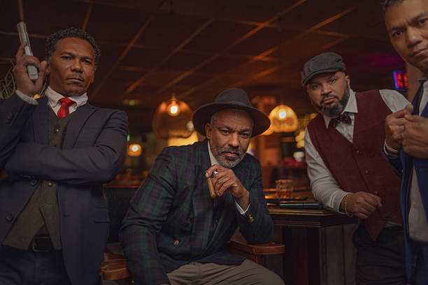 Small group of luxury black men friends enjoying downtime at a drinking bar in the Netherlands