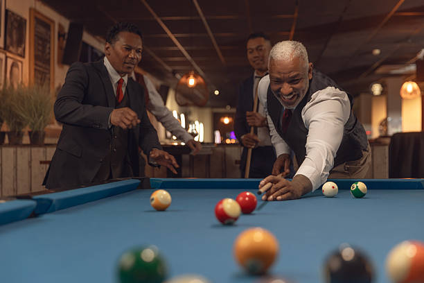 istock Group of diverse elegant senior friends at a pool hall 2252984274