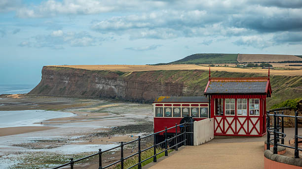 The Saltburn Cliff Lift is a funicular railway in Saltburn-by-the-Sea. The Lift, constructed between 1883 and 1884, replaced a 1870 vertical cliff hoist. The original cars have been replaced with aluminium counterparts, and the top station has been restored, but little of the underlying mechanism has changed since it was installed.