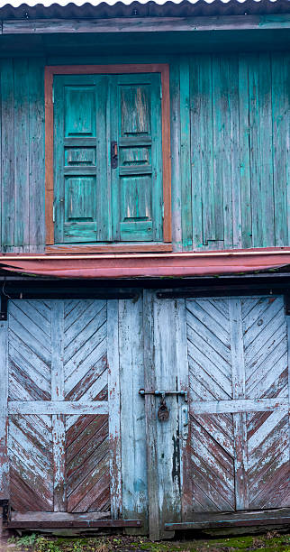 Old rustic wooden building with two weathered doors