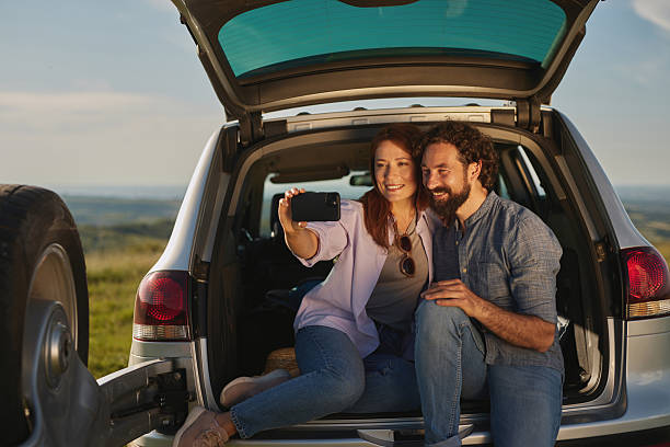 istock Couple taking a selfie during a road trip picnic 2252991233