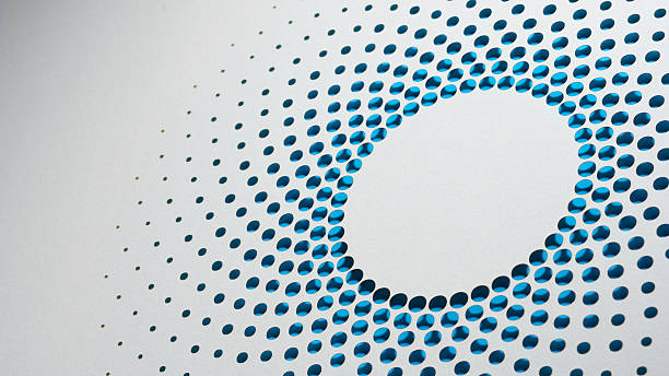 istock Abstract Perforated Paper Circle Still Life With Blue Radial Dot Pattern 2252991286