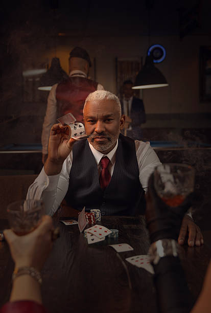 istock A handsome senior black boss man winning at a poker table 2252992317