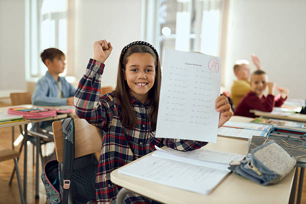 istock Happy student holding test with A grade 2252993915