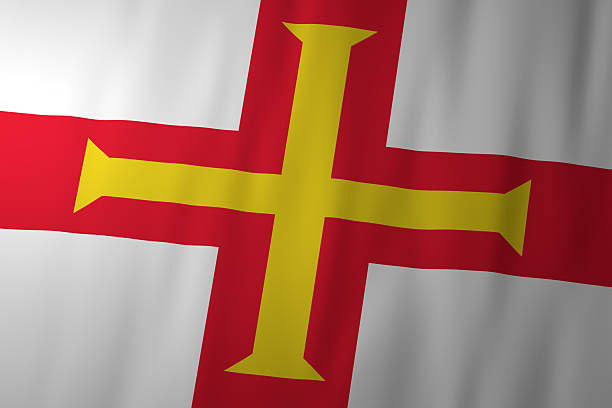 The national flag of Guernsey featuring a red cross with an additional gold cross on a white field. The image represents Guernsey’s identity, history, and cultural heritage.