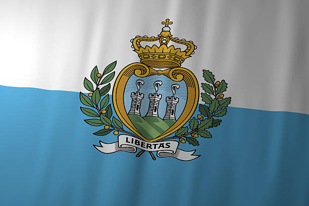 The national flag of San Marino featuring white and light blue horizontal fields with the historic coat of arms in the center. The emblem with three towers and a crown symbolizes liberty, independence, and the world’s oldest republic.