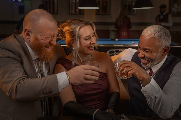 istock A beautiful senior blonde boss woman winning at a poker table 2252995433