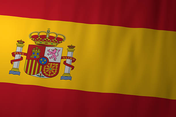 The national flag of Spain displaying red and yellow horizontal stripes with the Spanish coat of arms. The emblem reflects the country’s history, monarchy, and national identity.