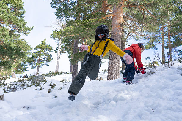 istock Children jumping and playing in snowy forest 2252995606