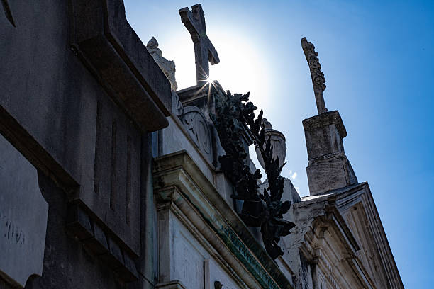 Tombs on famous Recoleta Cemetary in Buenos Aires under a deep blue sky, Argentina.