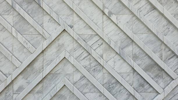 istock The wall is decorated with white granite slabs with a diagonal pattern, creating a smooth and luxurious surface. 2253002412