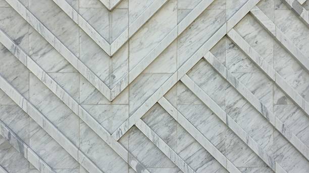 istock The wall is decorated with white granite slabs with a diagonal pattern, creating a smooth and luxurious surface. 2253002418