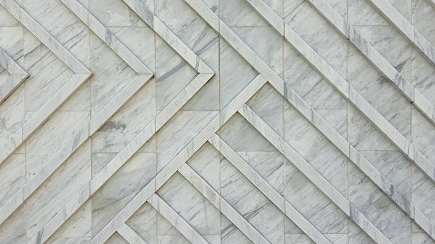 istock The wall is decorated with white granite slabs with a diagonal pattern, creating a smooth and luxurious surface. 2253002421