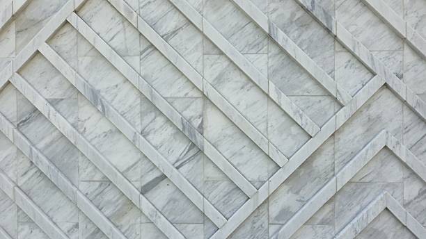 istock The wall is decorated with white granite slabs with a diagonal pattern, creating a smooth and luxurious surface. 2253002422