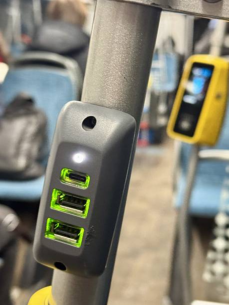 istock Bus With Powered USB Ports, Crowded Transit Vehicle Featuring USB Charging Points For Passengers, Inside Busy City Bus With Multiple Powered USB Ports Near Ticket Validation Area 2253004759