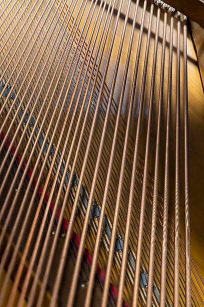 istock piano soundboard with strings close up 2253005981