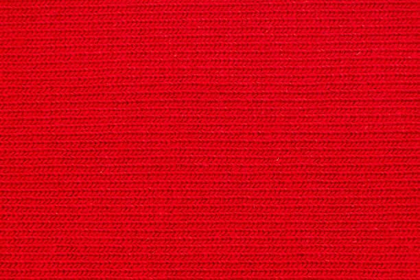 istock Cotton texture pattern closeup. Macro shot red cotton texture background. Knitting pattern of cotton. Texture of fabric 2253006707