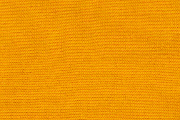 istock Cotton texture pattern closeup. Macro shot yellow cotton texture background. Knitting pattern of cotton. Texture of fabric 2253008457