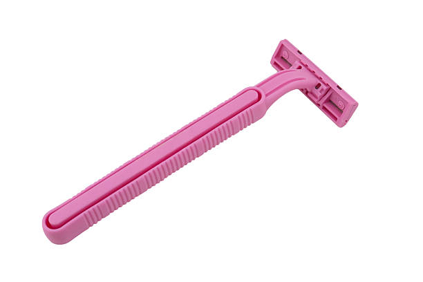 istock Pink disposable razor blade isolated on white background. Single use razor blade. Disposable shaving razor. 2253008794