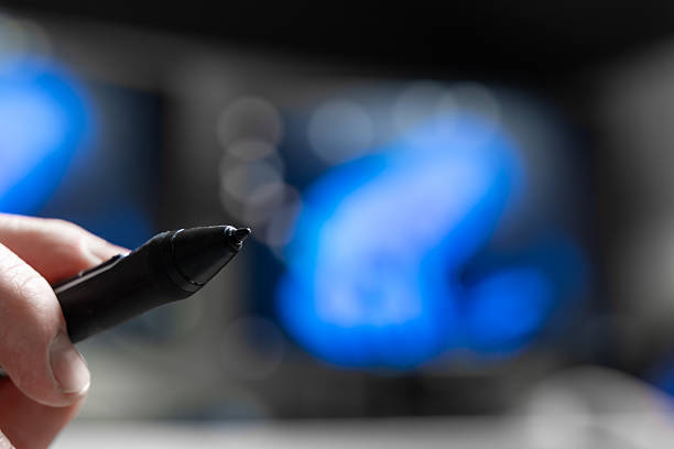 Closeup Of Stylus Pointed Toward Screen In Modern Workspace, Showing Digital Writing And Touch Input For Notes, Drawing, Education, And Everyday Tablet Productivity.