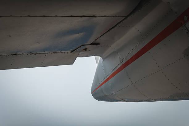 istock Passengers view the wing of a small aircraft cutting through low-hanging clouds during a scenic flight 2253012154